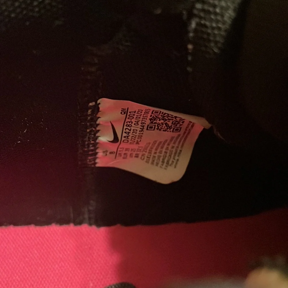 Nike Black High-Top Sneakers with White Sole and Pink Logo